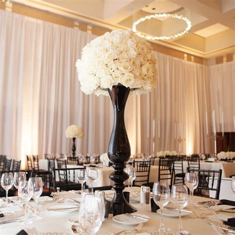 black tall vases centerpieces